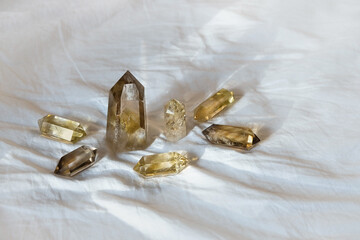 Clear quartz crystals Altar Kit on abstract textile background. minerals for Crystal Ritual, Chakra Relaxation, Wiccan Witchcraft, esoteric spiritual practice. reiki healing therapy, aura readings