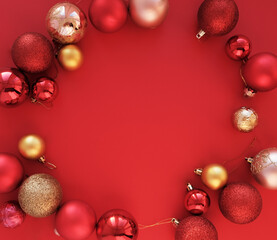 The concept of congratulations on Christmas and New Year, Christmas balls on a red background