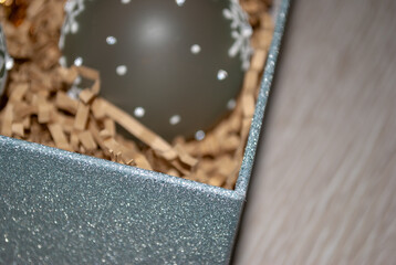 Christmas composition with decorations, Christmas ornaments, gift boxes in a basket. White background.Top view.