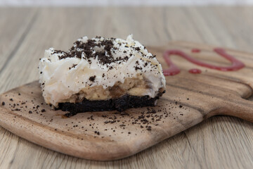 Finishing a meal with a sweet dessert consisting of banana cream pie served on a cutting board and sprinkled with chocolate