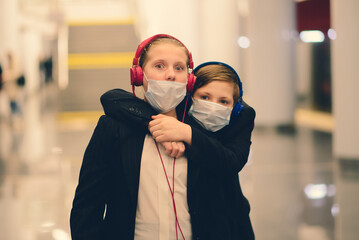 Children with face mask going back to school after covid-19 quarantine and lockdown.