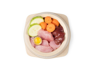 Natural pet food bowl. Natural food for dogs. Isolated on white background, top view.