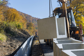 Construction site road burial of u-shaped gutter precast concrete drain
