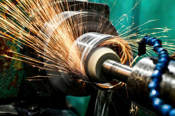 Processing a cylindrical part internal grinding from which sparks fly away.