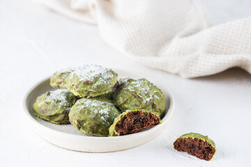 Chocolate gingerbread cookies with matcha and mint in a plate. Sugar, gluten and lactose free and vegan.