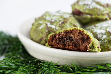 Chocolate gingerbread cookies with matcha in mint glaze in a plate. Sugar, gluten and lactose free...