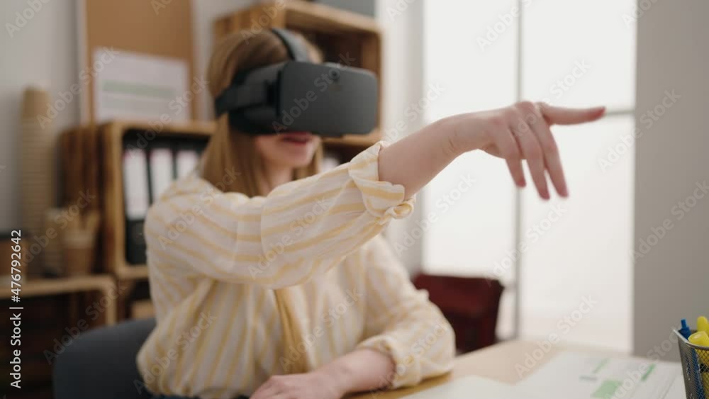 Sticker Young blonde woman business worker using virtual reality glasses at office