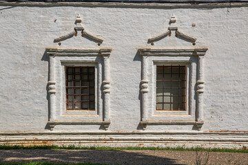 Windows of the stone wall of Russian church