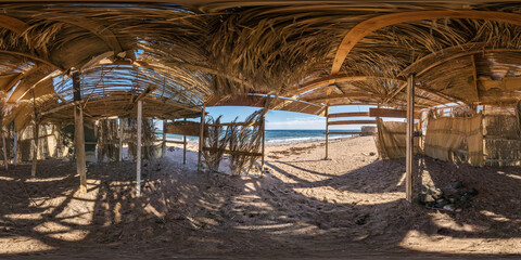 full seamless spherical hdri panorama 360 degrees angle view abandoned thatched shack or palm tree...