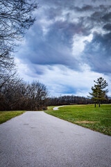 Paved park trail during early morning hours in Veteran's park, Lexington, Kentucky USA