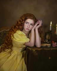 Portrait of a red-haired girl at a table with candles