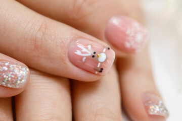 Drawing of a Christmas deer in nail design. Creative drawings in manicure. New Year's manicure....