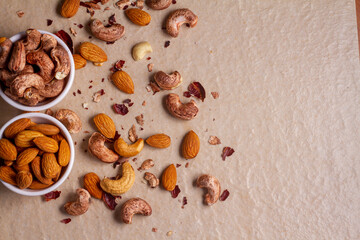 cashews and almond isolated on light background. Top view. Flat lay