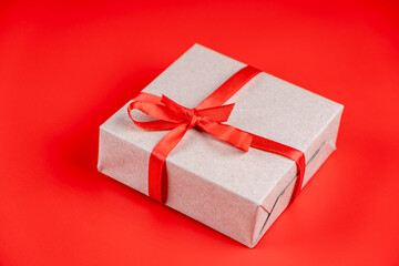  gift box with red ribbon and bow on red background. Concept for lovers or Valentine's day or birthday