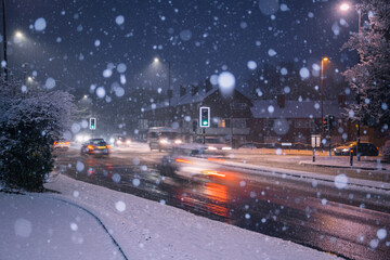 Fototapeta na wymiar Traffic during snowfall in England, UK