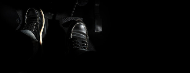 Accelerator and breaking pedal in a car. Close up the foot pressing foot pedal of a car to drive...