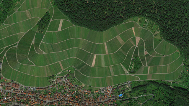 Cultivated fields and forest and town, looking down aerial view from above, bird’s eye view large fields and forest, Strümpfelbach, Weinstadt, Germany