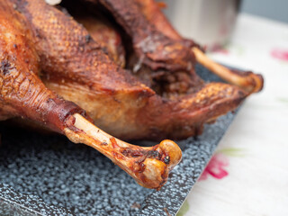 Close up of roast goose with blurred background.