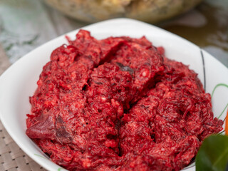 Red beet salad with herbs.