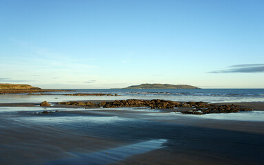 Fototapeta na wymiar Seascape. The shore of the Irish Sea on a clear December evening.