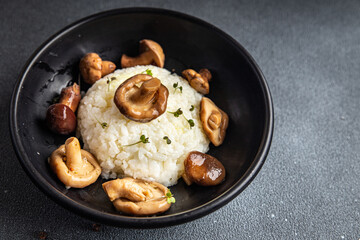 rice with mushroom second course risotto mushrooms healthy meal food snack on the table copy space food background rustic
