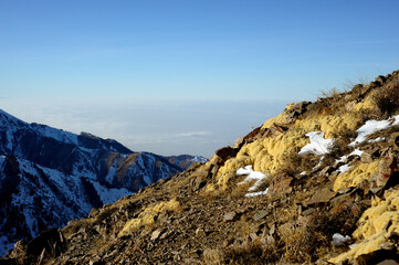 Fototapeta premium Majestic mountain peaks covered with snow (altitude: over 3200 meters). Ile Alatau, also spelt as Trans-Ili Alatau, etc., is a part of the Northern Tian Shan mountain system in Kazakhstan