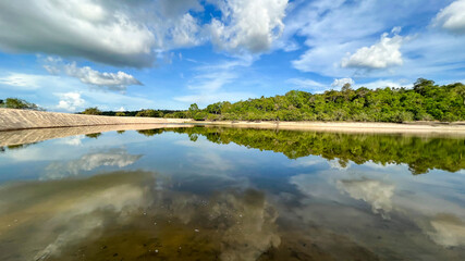 Naklejka na ściany i meble Reflections in water. Landscape in the Tapajos River, Brazilian Amazon.