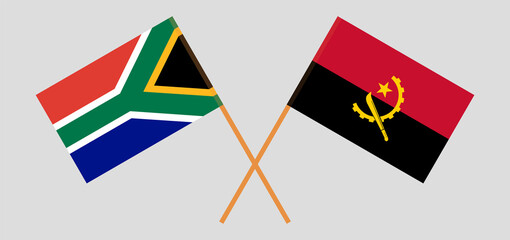 Crossed flags of South Africa and Angola. Official colors. Correct proportion