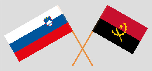 Crossed flags of Slovenia and Angola. Official colors. Correct proportion