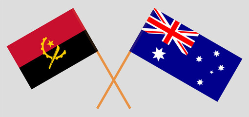 Crossed flags of Angola and Australia. Official colors. Correct proportion