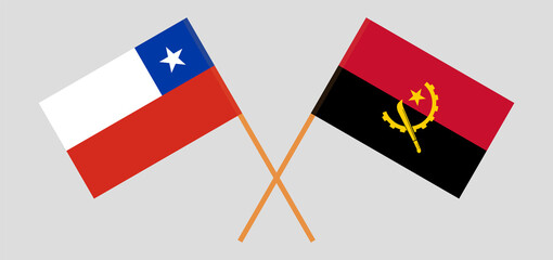 Crossed flags of Chile and Angola. Official colors. Correct proportion