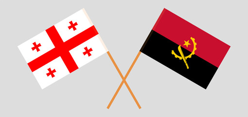Crossed flags of Georgia and Angola. Official colors. Correct proportion
