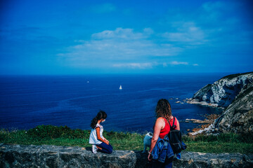 Fototapeta premium mother and daughter watching the sea