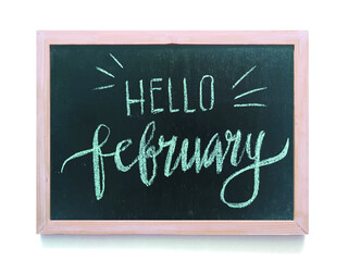 Hello February word on black chalkboard background. Art, Business, weekend, holiday or new year planning concept.