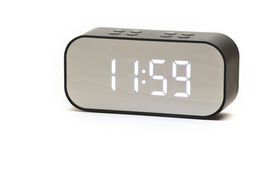Clock with a time of 11 hours 59 minutes on a white background