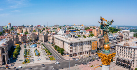 Aerial view of the Kyiv Ukraine above Maidan Nezalezhnosti Independence Monument. Golden beautiful Ukrainian woman statue in the middle of the city.