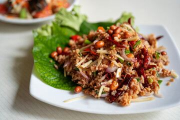 Homemade Spicy Thai Sausages Salad with blurred background