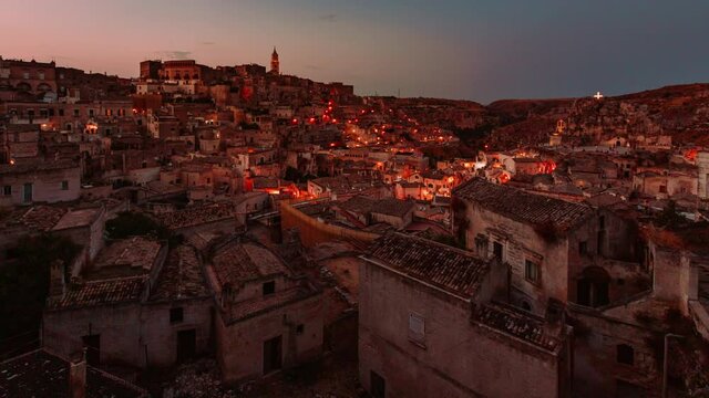 Sassi of Matera from sunset to night with illumination of the houses, Timelapse 4k