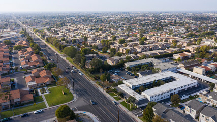 Daytime aerial view of the dense urban core of downtown Stanton, California, USA. - obrazy, fototapety, plakaty
