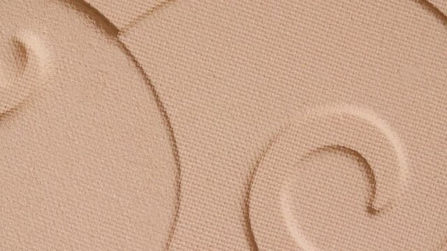 Make-up beige foundation with pattern, rotating. Cosmetic bb cream Close-up. Macro Shot. Beautiful Makeup concept. High quality 4k footage