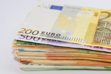 Close up of euro banknotes. Euro stack on white. A bundle of money.