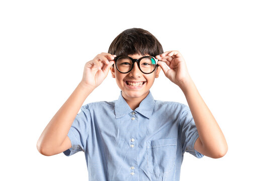 Smart boy in big glasses is smiling open mouth with big eyes surprised excited and shocked by new glasses, Education inspired. Gadgets poor vision and Emotions concept ideas. Over white background