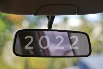 2022 numbers in the car's rearview mirror. Merry Chrismast and Happy New Year