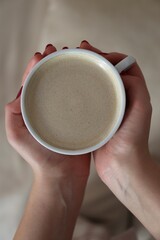 person holding a cup of coffee