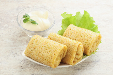 Stuffed pancakes with meat and cream