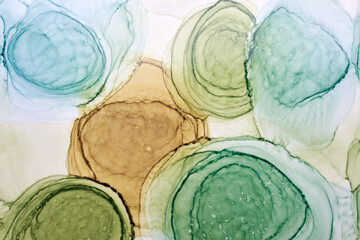 Abstract ocher green circles watercolor background. orange brown paint stains and spots in water,...