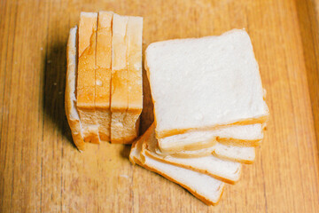 freshly sliced ​​bread, homemade food, wooden tray.