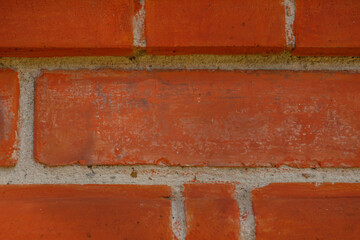 Brick wall from red bricks close-up. Horizontal texture