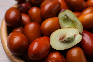 Fresh Ziziphus jujuba fruits in bowl, closeup