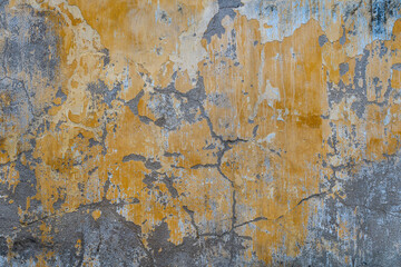Obraz na płótnie Canvas Background of old yellow painted wall, close up texture